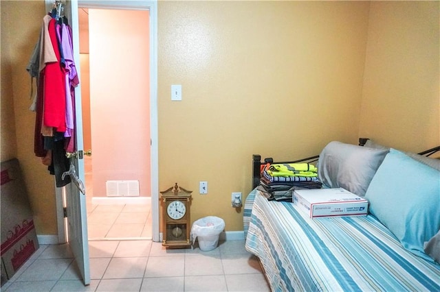 bedroom featuring light tile patterned flooring