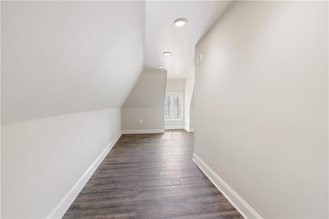 bonus room featuring lofted ceiling and dark hardwood / wood-style floors