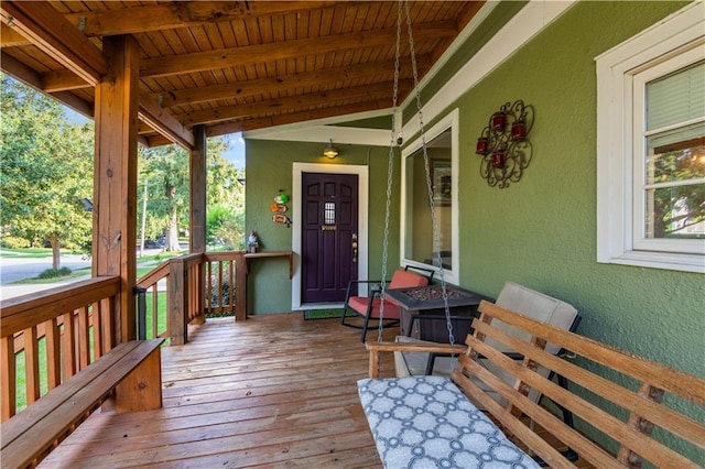 wooden deck featuring covered porch