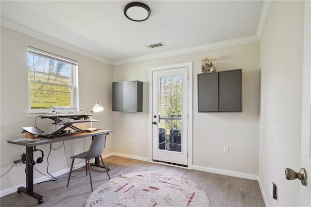 office with ornamental molding and light wood-type flooring