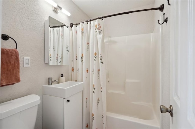 full bathroom featuring vanity, shower / tub combo with curtain, and toilet