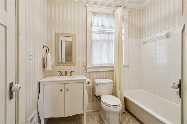 full bathroom with shower / tub combo with curtain, toilet, vanity, ornamental molding, and tile patterned flooring