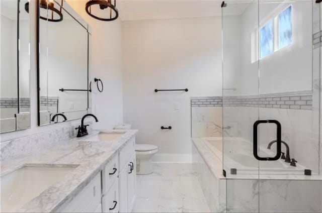 bathroom featuring vanity, toilet, and a bathing tub