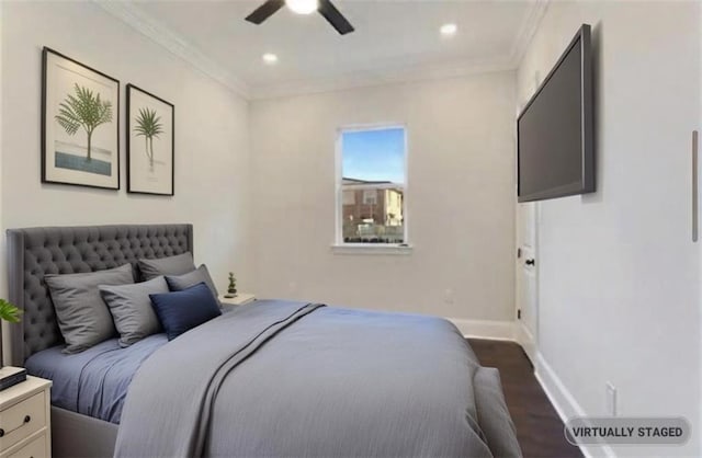 bedroom featuring crown molding, dark hardwood / wood-style floors, and ceiling fan