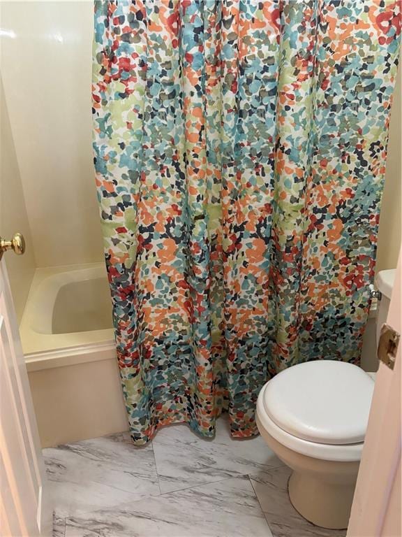 bathroom with walk in shower and toilet