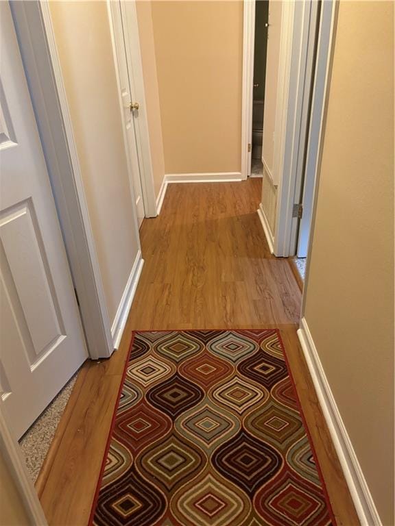 hallway with light wood-type flooring