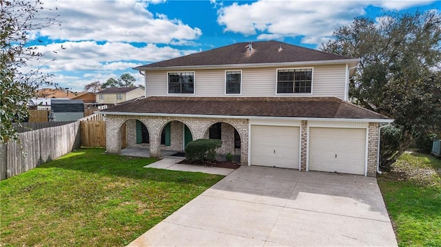 view of front facade featuring a garage and a front lawn