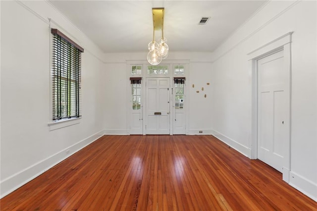 entrance foyer featuring hardwood / wood-style floors