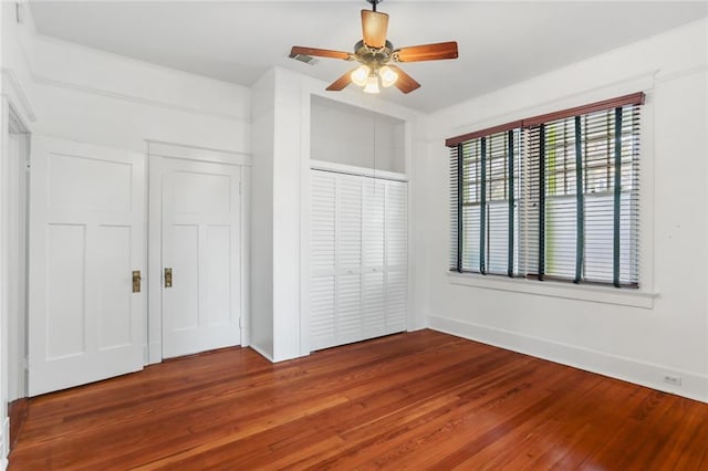 unfurnished bedroom featuring ceiling fan and wood-type flooring