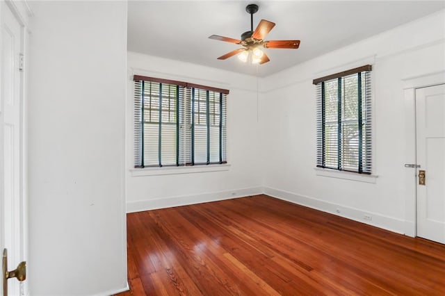 spare room featuring hardwood / wood-style flooring and ceiling fan