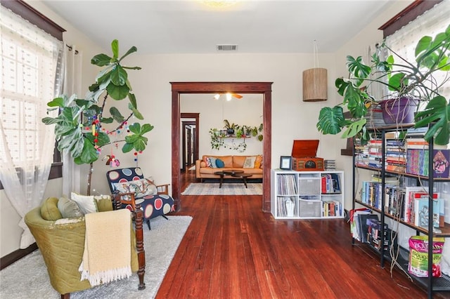 sitting room with dark hardwood / wood-style flooring