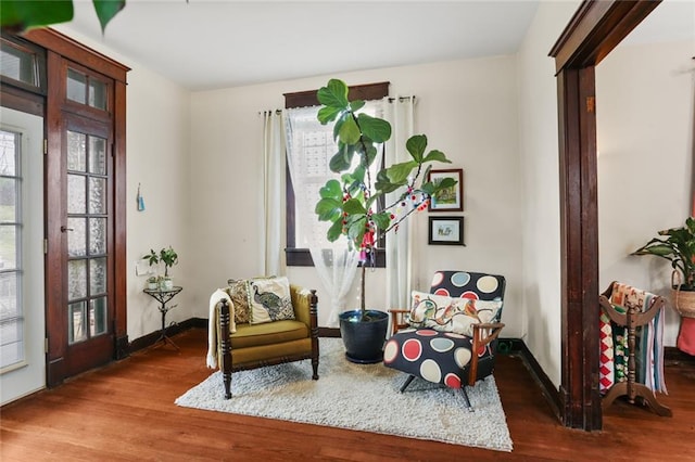 sitting room featuring hardwood / wood-style flooring