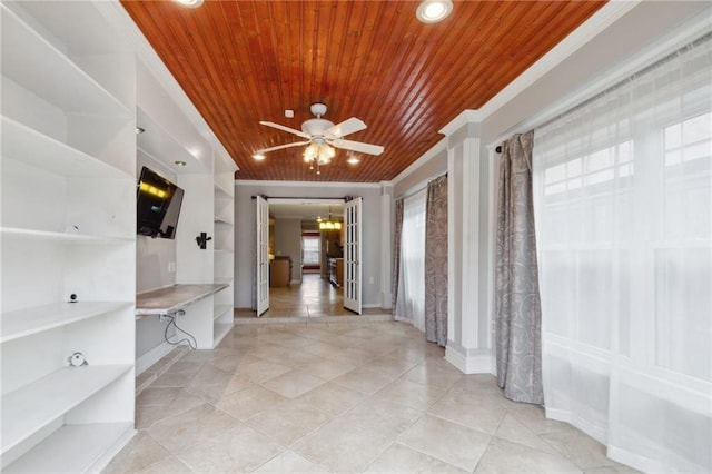 corridor with light tile patterned floors, wood ceiling, ornamental molding, and a chandelier