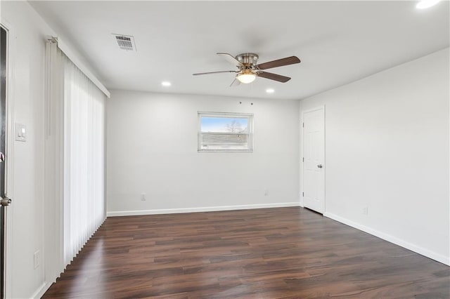 unfurnished room with dark hardwood / wood-style floors and ceiling fan