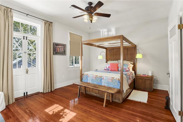 bedroom featuring dark hardwood / wood-style floors and ceiling fan