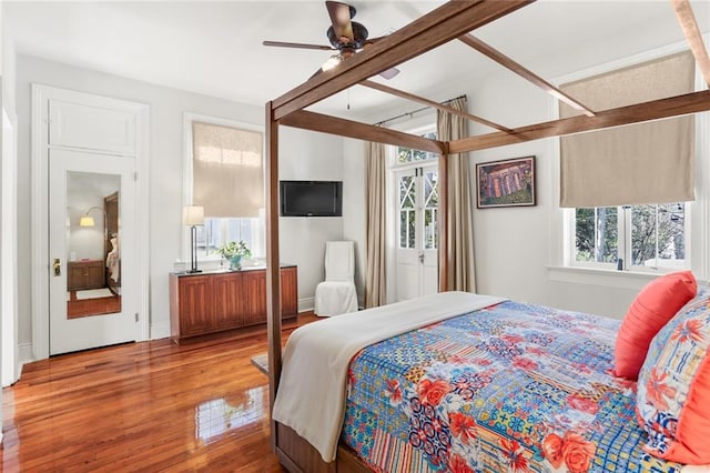 bedroom with hardwood / wood-style floors and ceiling fan