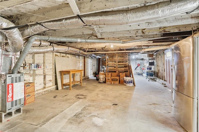 basement with stainless steel refrigerator