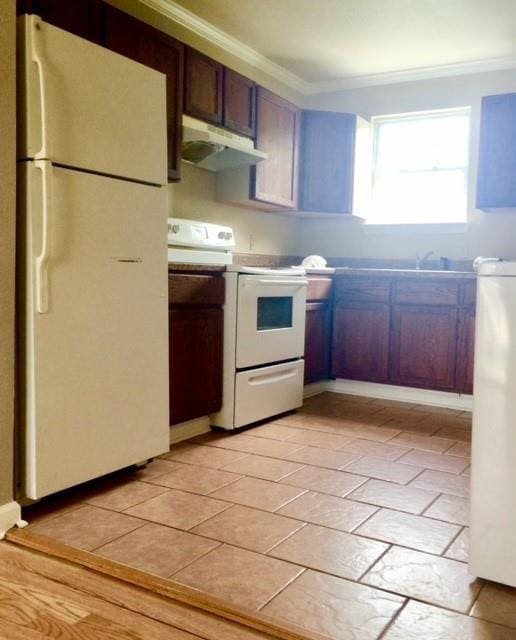 kitchen with ornamental molding, white appliances, a sink, and under cabinet range hood