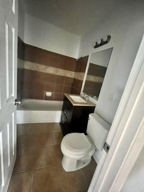 full bath with vanity, toilet, and tile patterned floors