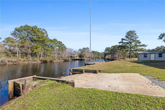 view of dock featuring a water view and a lawn