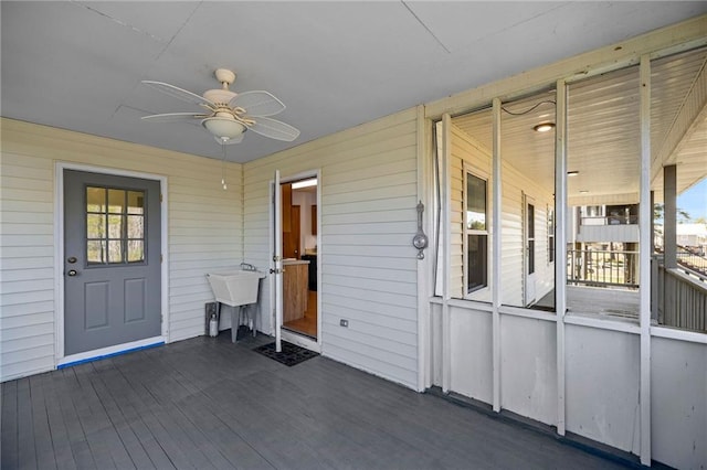 exterior space featuring sink and ceiling fan