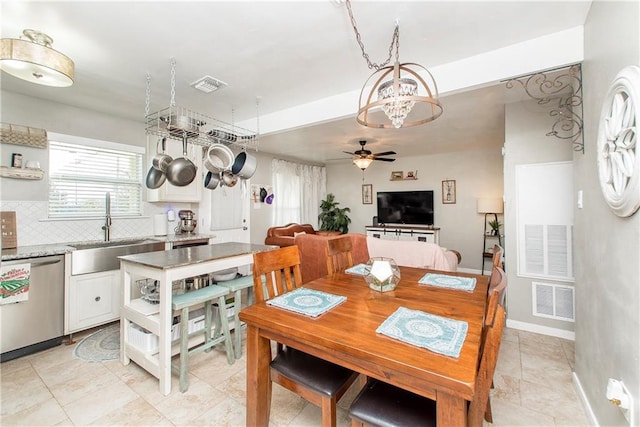 dining room with sink and ceiling fan