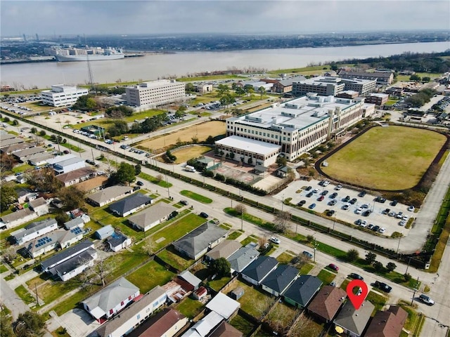 birds eye view of property with a water view