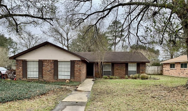 single story home featuring a front yard