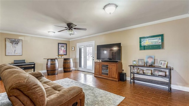 living room featuring ceiling fan, ornamental molding, and dark hardwood / wood-style flooring