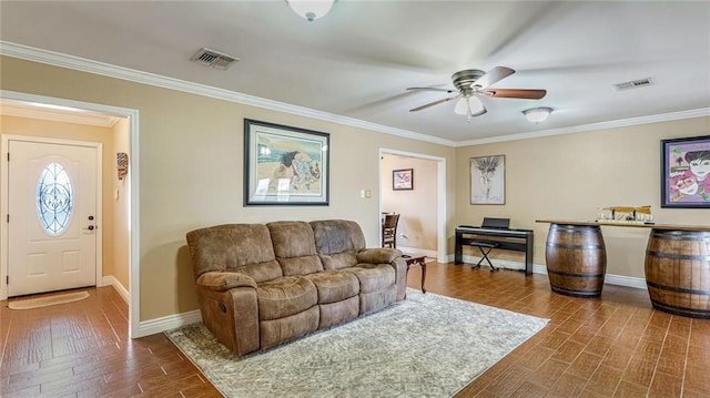 living room featuring hardwood / wood-style flooring, ceiling fan, and ornamental molding