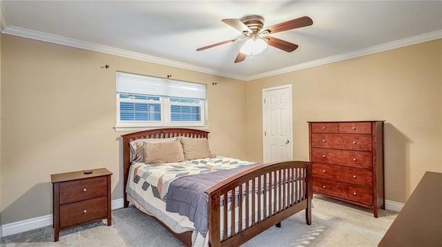 bedroom featuring ornamental molding, light colored carpet, and ceiling fan