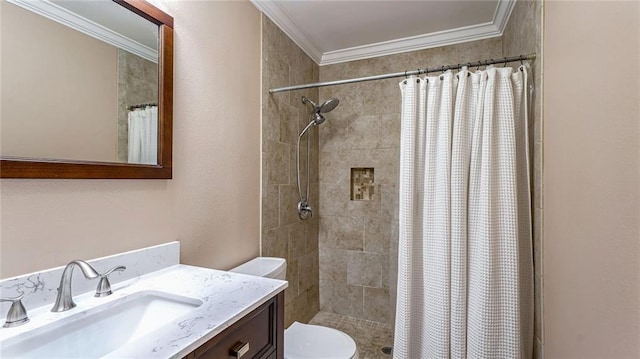 bathroom with crown molding, vanity, toilet, and curtained shower