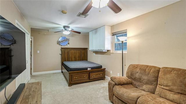 interior space featuring light carpet and ceiling fan