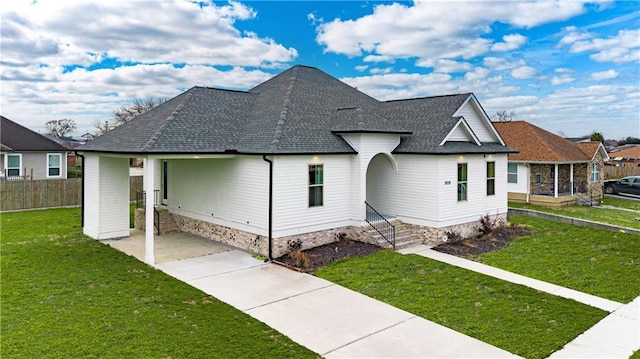 view of side of home with a yard