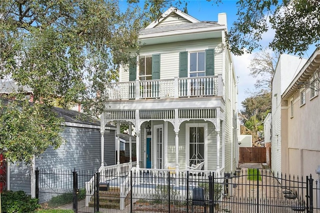 view of front facade with a porch and a balcony