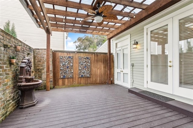 wooden terrace with a pergola, ceiling fan, and french doors