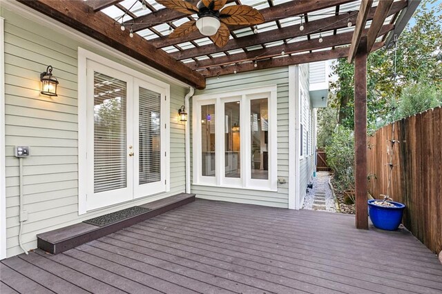 deck featuring a pergola, french doors, and ceiling fan