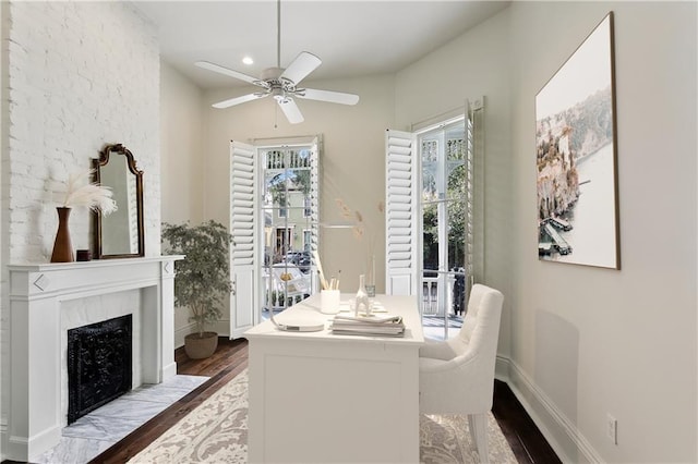 dining room with ceiling fan and light hardwood / wood-style flooring