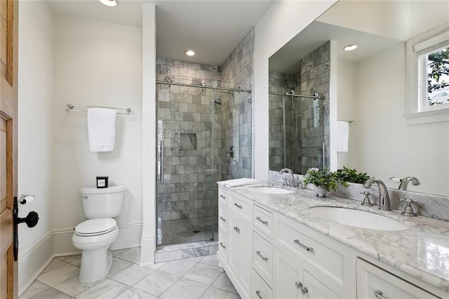 bathroom with vanity, toilet, and walk in shower