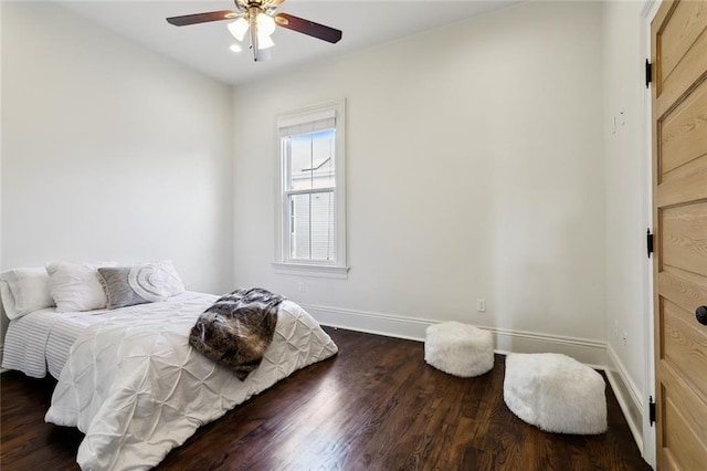 bedroom featuring dark wood-type flooring and ceiling fan