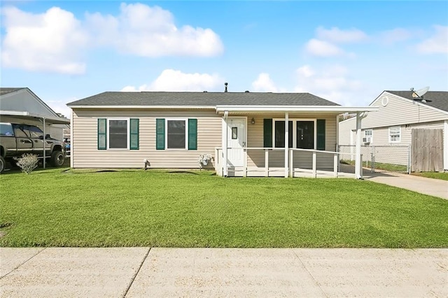 ranch-style house with a front lawn and fence