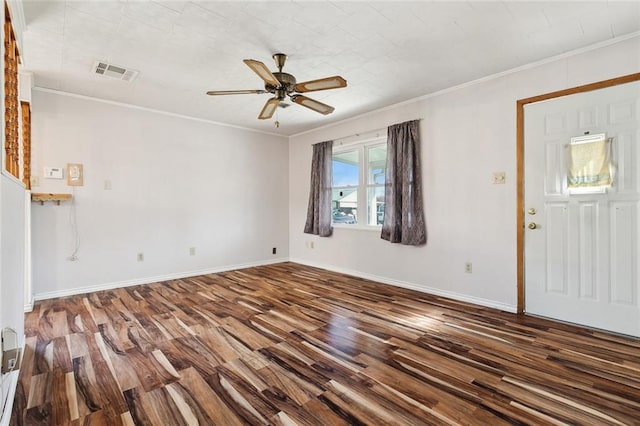 unfurnished living room with crown molding, visible vents, ceiling fan, wood finished floors, and baseboards