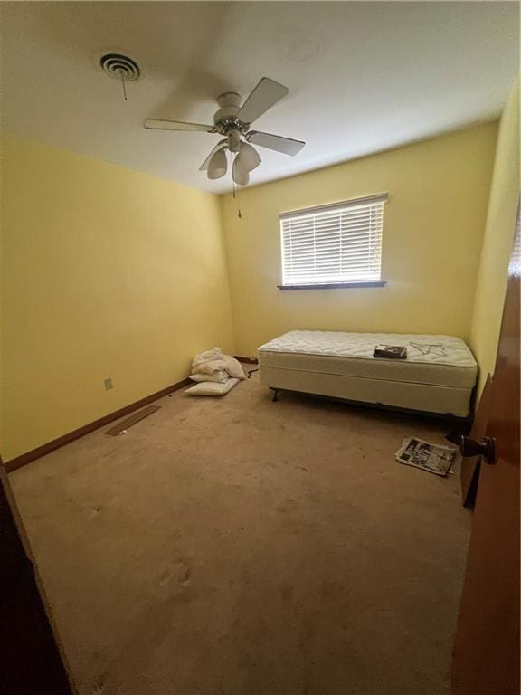 unfurnished bedroom featuring carpet flooring and ceiling fan