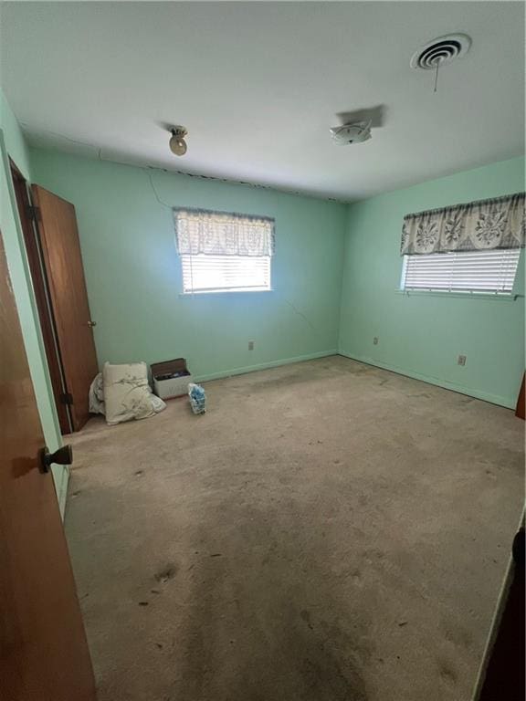 unfurnished bedroom featuring light colored carpet