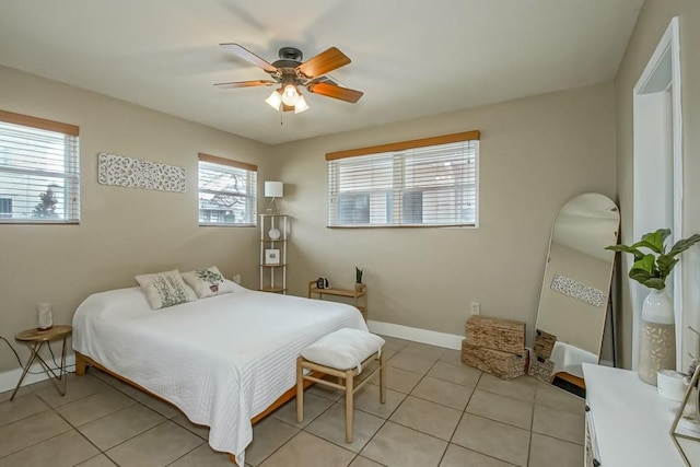 bedroom with light tile patterned floors and ceiling fan