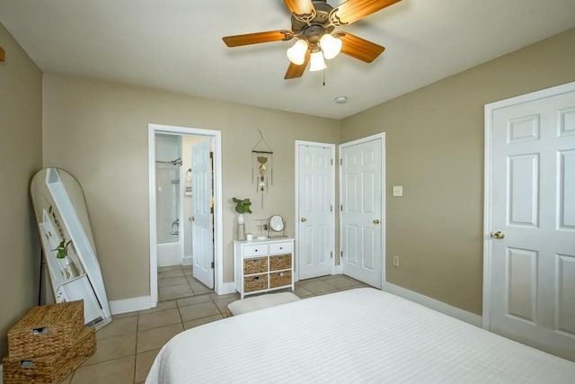 bedroom with ceiling fan, ensuite bath, and light tile patterned floors