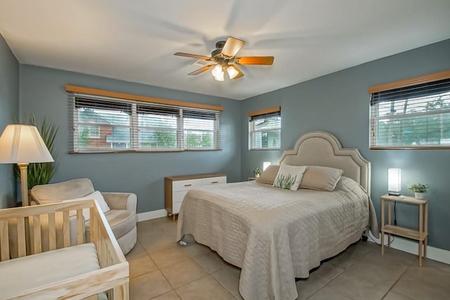 bedroom with light tile patterned floors and ceiling fan