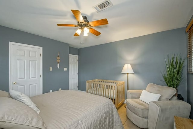 bedroom featuring light tile patterned floors and ceiling fan