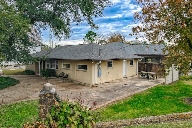 back of property featuring a patio area