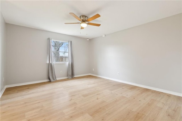 spare room with ceiling fan and light hardwood / wood-style flooring